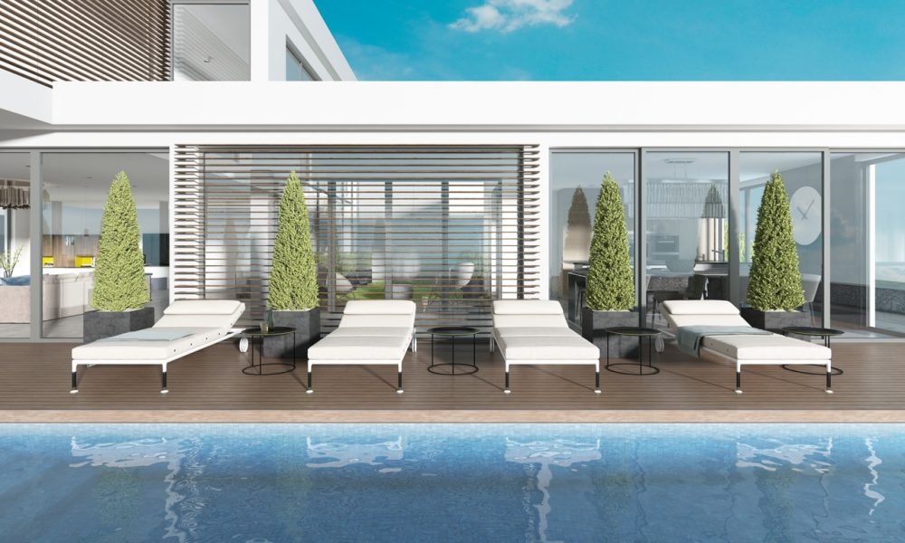 Terrace by the pool with sun loungers near the modern house. 3D rendering
